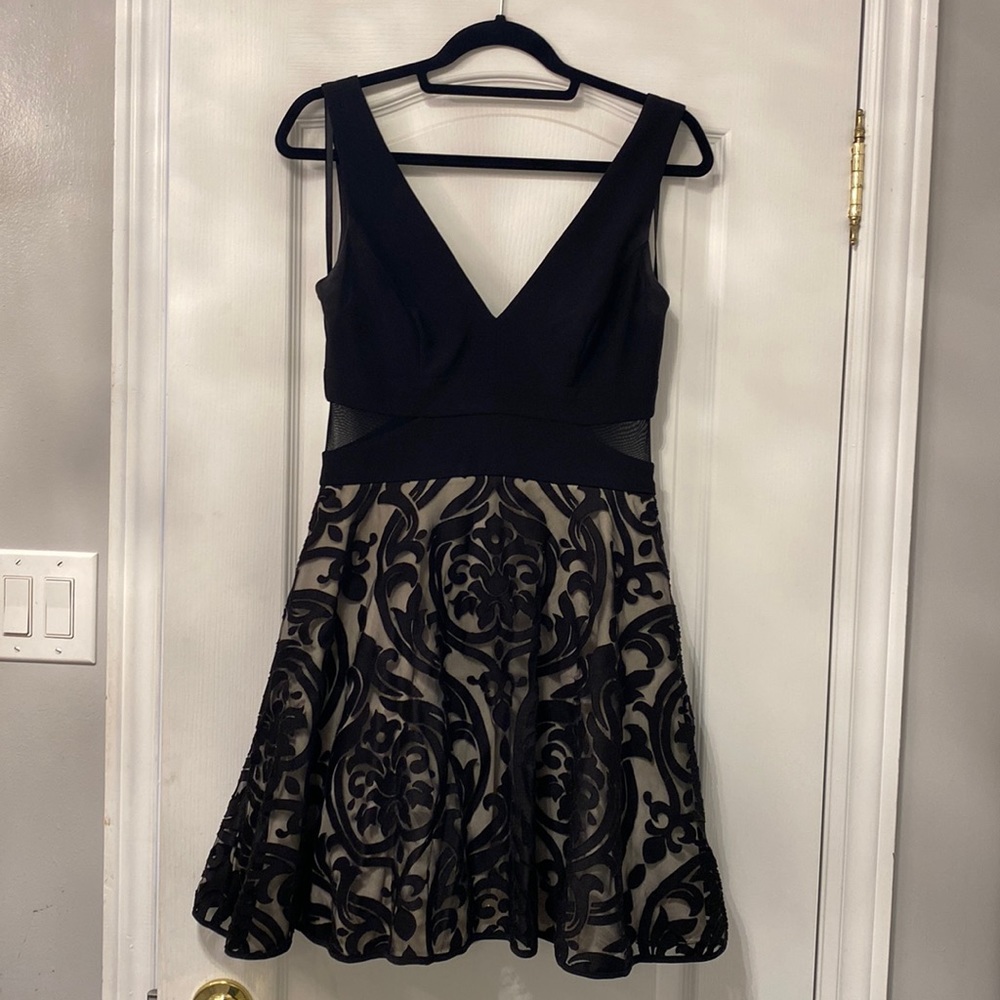 Black mini cocktail dress size 8 v neck and back.